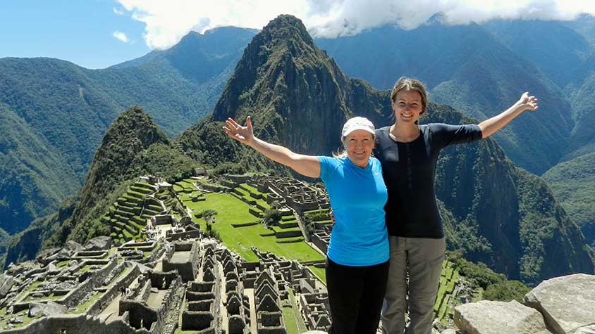Inca Trail Hikers enjoying a Sunny day at Machu Picchu on the 4th day Inca Trail Guided Tour